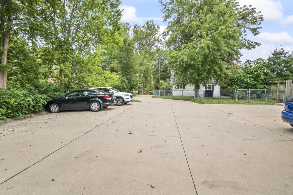a parking lot with cars parked on the side of it