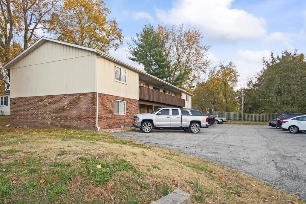 a building with cars parked in front of it