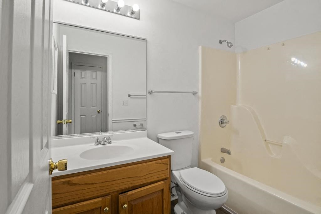 a bathroom with a sink toilet and a shower
