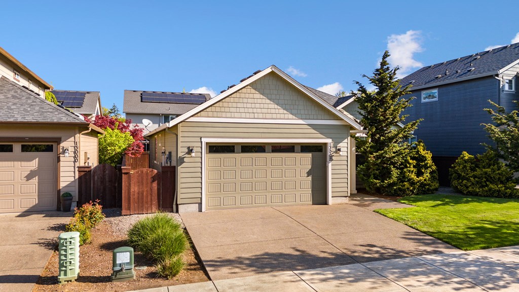 A house with a garage and a driveway.