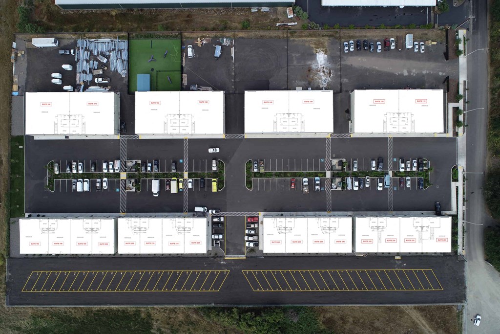 a birds eye view of the parking lot of a building