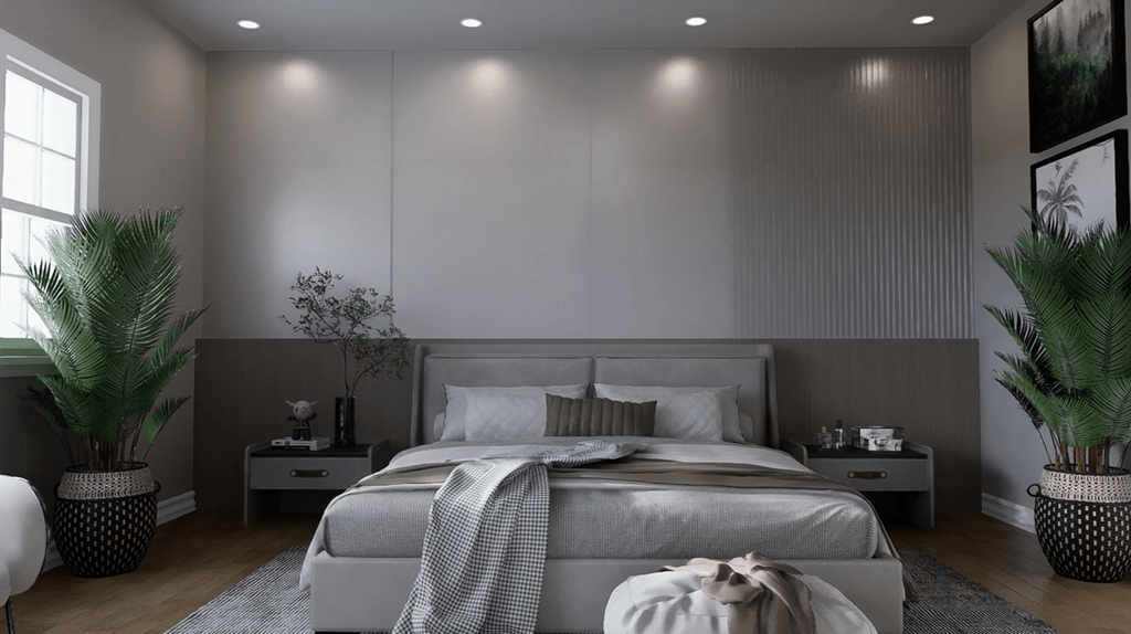 A modern bedroom with a large bed and two potted plants.