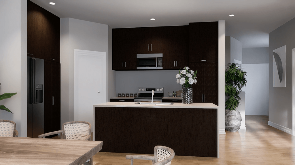 A modern kitchen with dark brown cabinets and a white island.