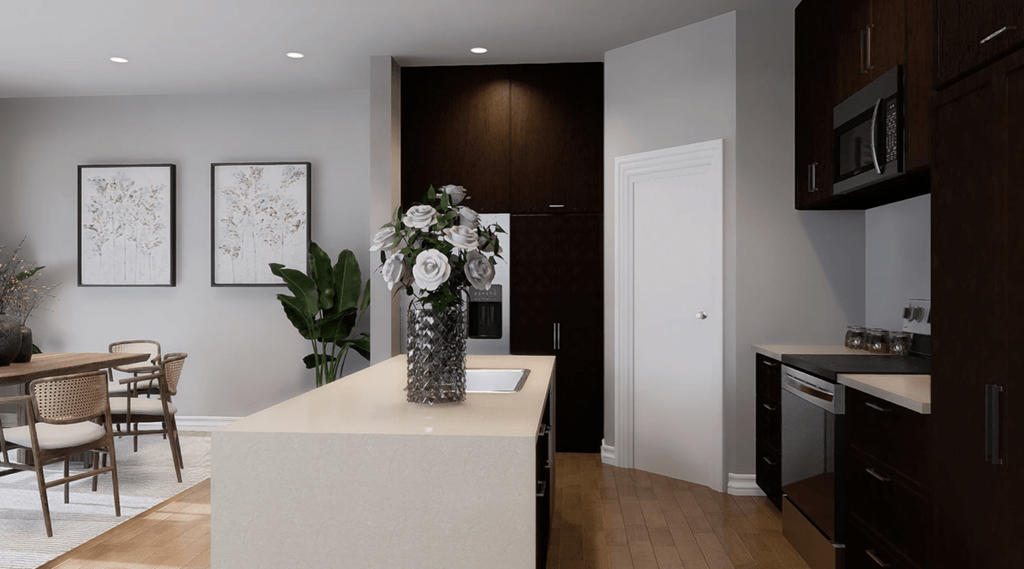 A kitchen with a white island and brown cabinets.