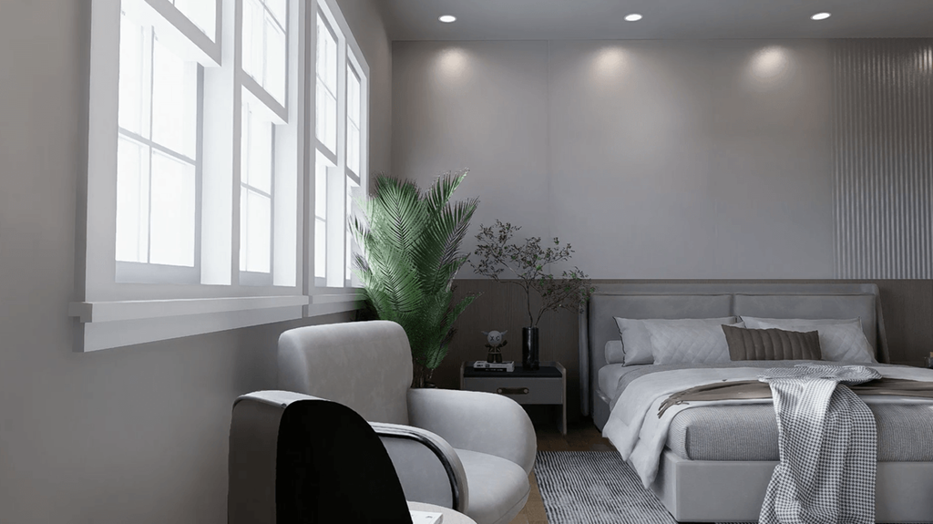 A modern bedroom with a large bed and a potted plant.