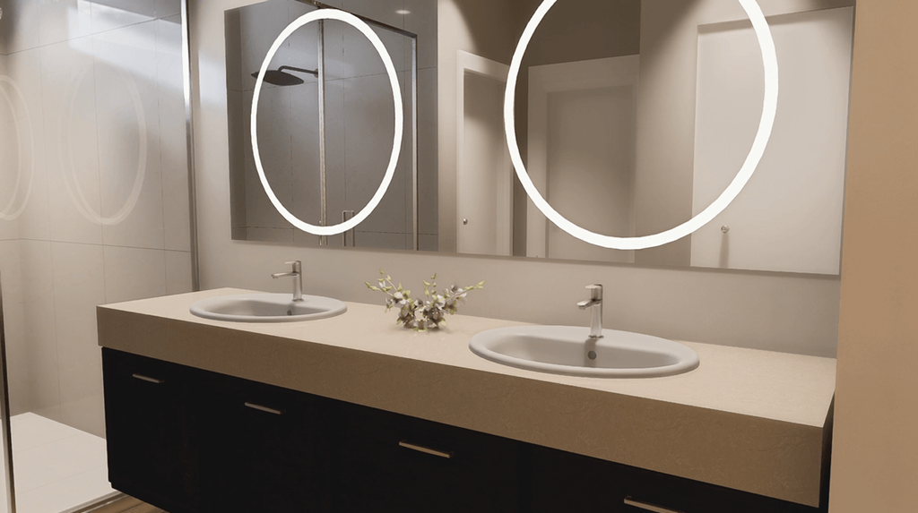 A bathroom with two sinks and a mirror.