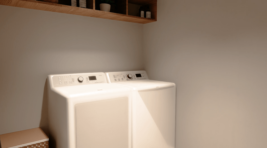 A white washing machine in a laundry room.