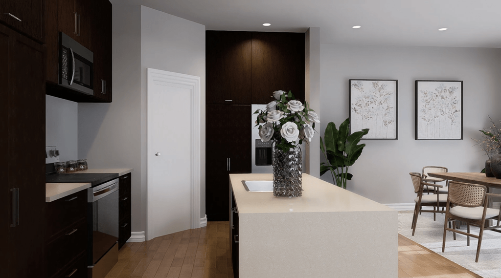 A kitchen with a white countertop and a white sink.