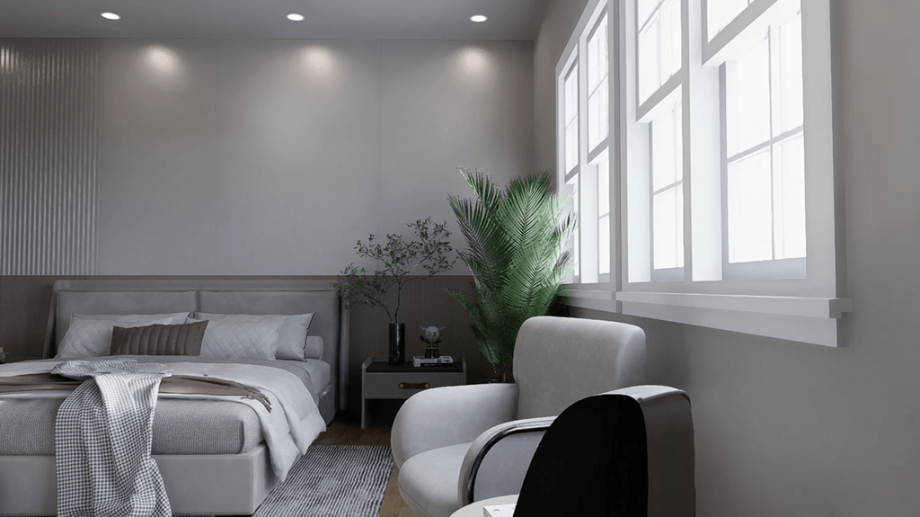 A modern bedroom with a large bed and a chair.