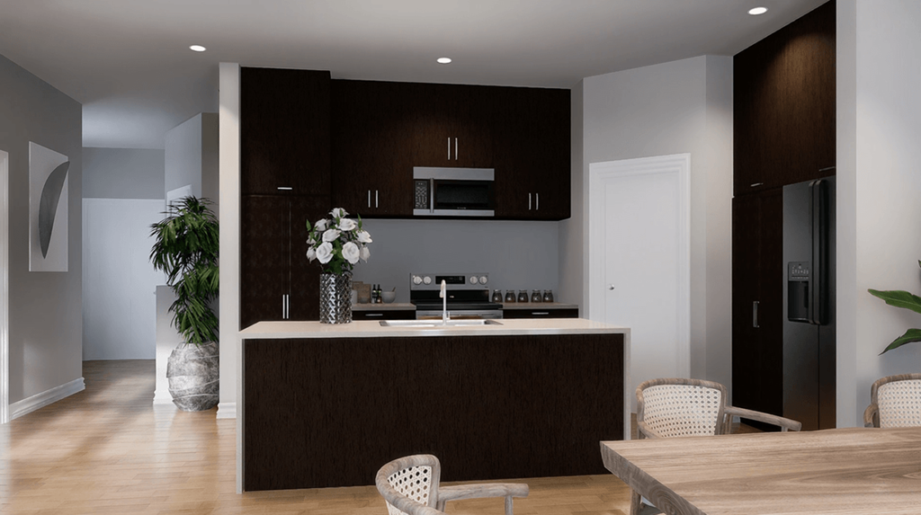 A modern kitchen with dark brown cabinets and a wooden island.