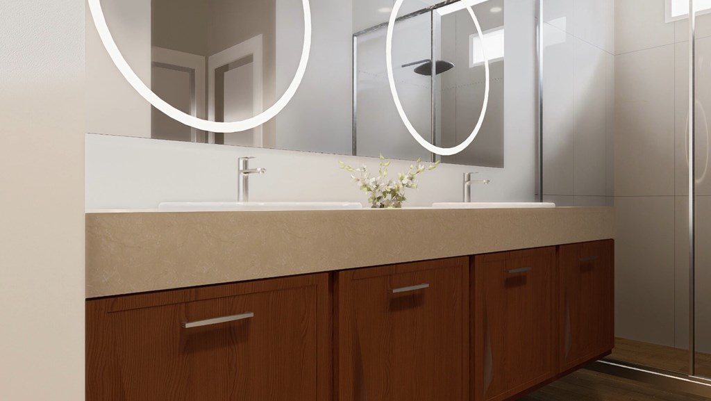 A bathroom with a sink, mirror, and wooden cabinets.