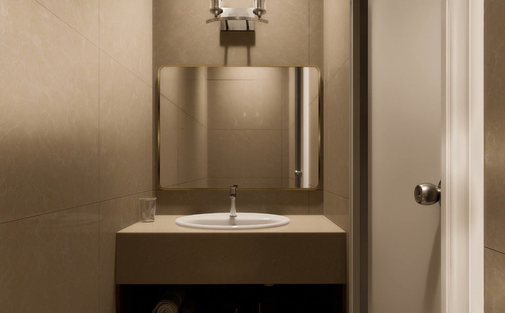 A bathroom sink with a mirror above it.