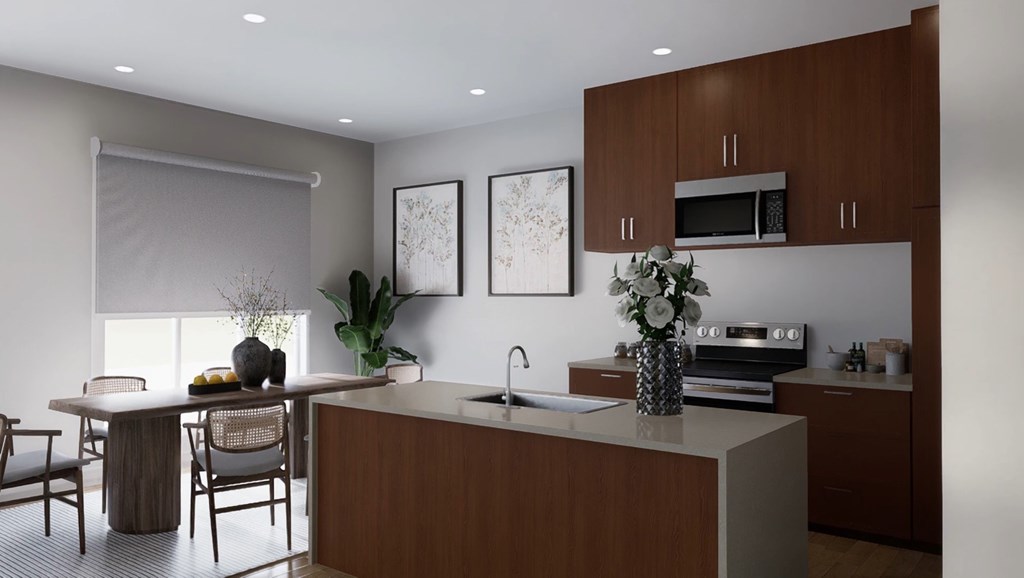 A modern kitchen with brown cabinets and a dining table with chairs.