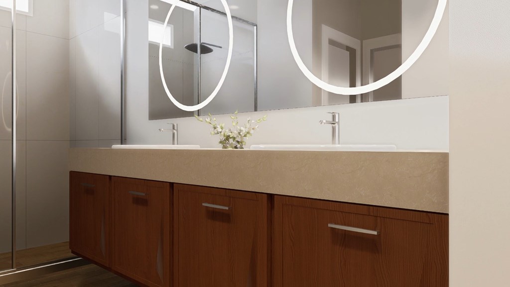 A bathroom with a sink, mirror, and wooden cabinets.