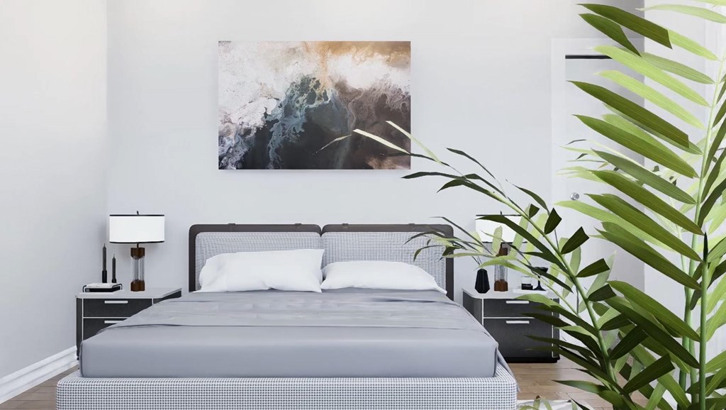 A bedroom with a bed, nightstand, lamp, and a painting on the wall.