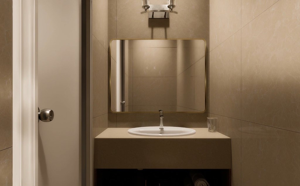 A bathroom sink with a mirror above it.