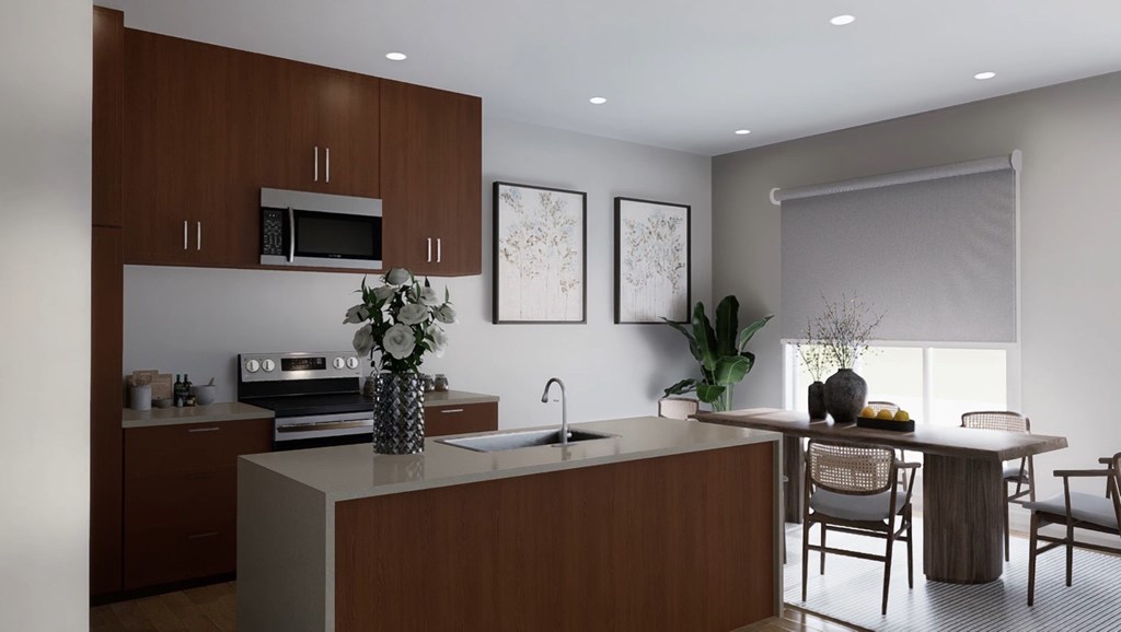 A modern kitchen with brown cabinets and a white countertop.