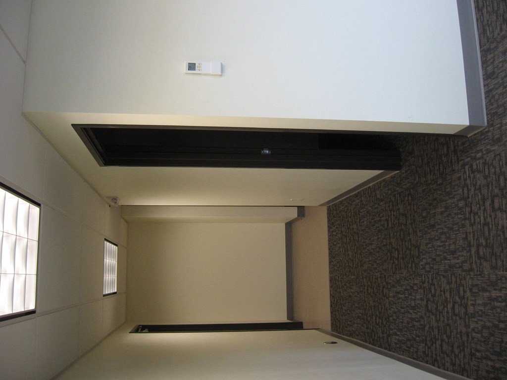 a view of the ceiling in a hallway of a building