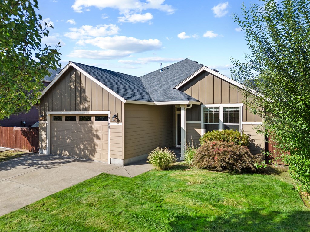 A house with a garage and a driveway.