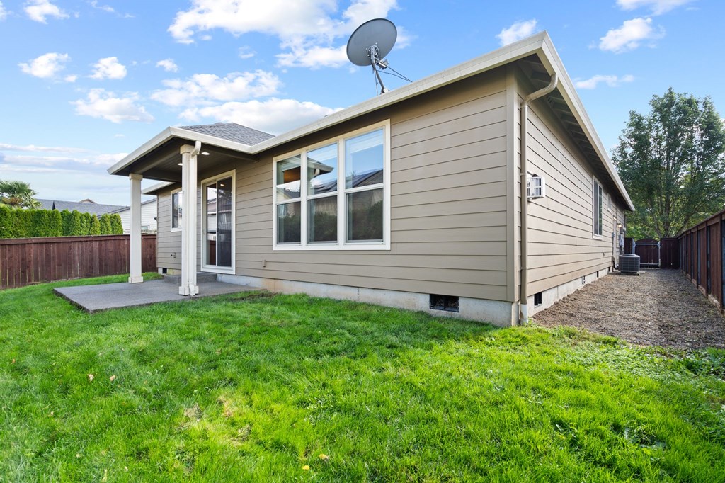 A house with a satellite dish on the roof.