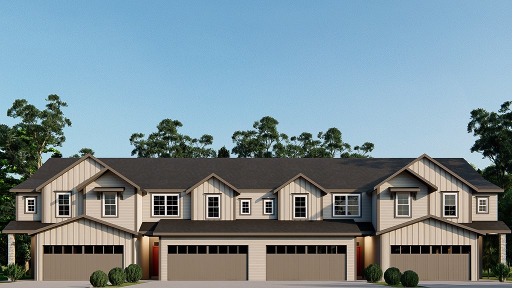 A modern house with a grey roof and a red garage door.