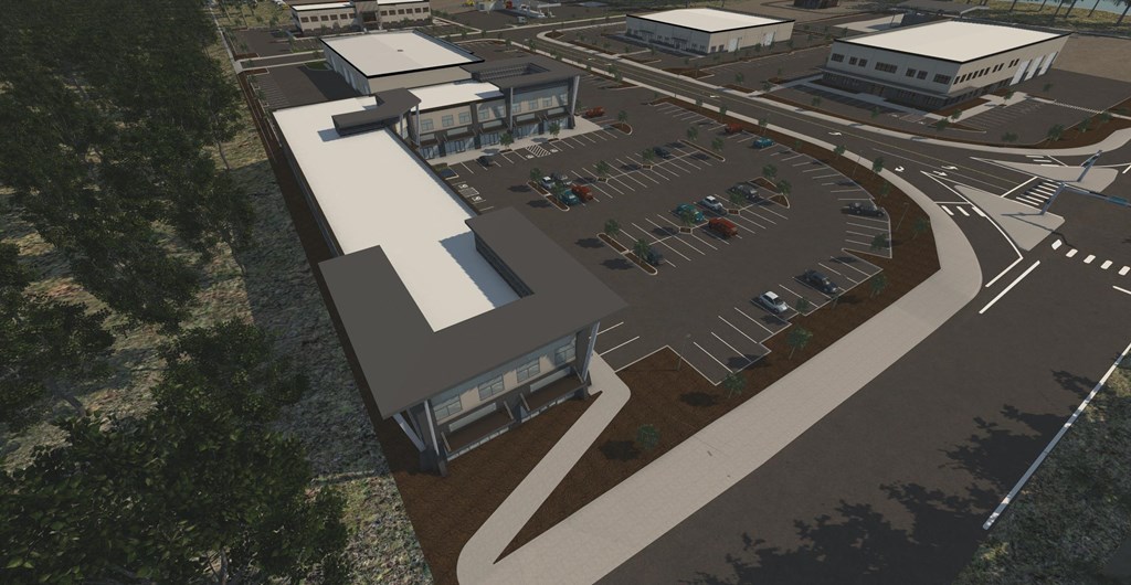 an aerial view of a parking lot and buildings