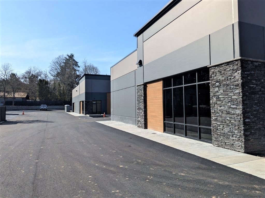 the exterior of a building with a street in front of it