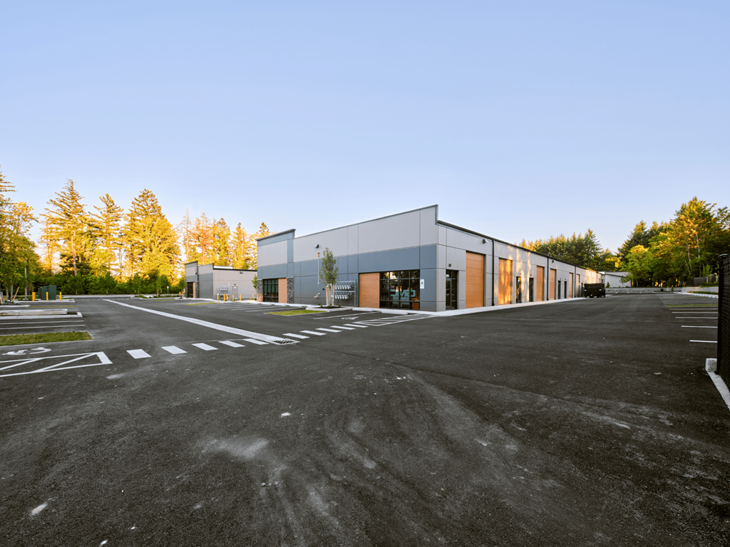 a large building with a parking lot in front of it
