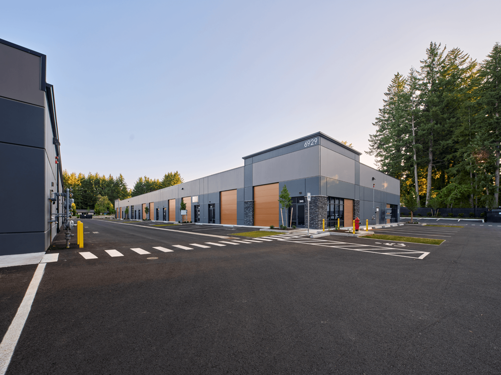 a building with a parking lot in front of it