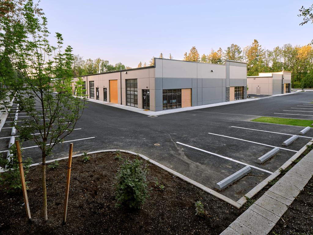 an empty parking lot in front of a building