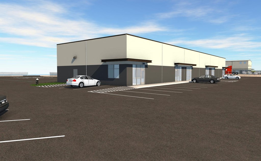 a white and black building with cars parked in a parking lot