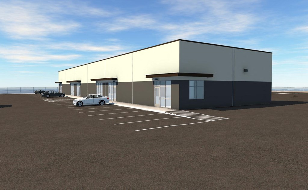 a commercial building with a parking lot and cars parked outside