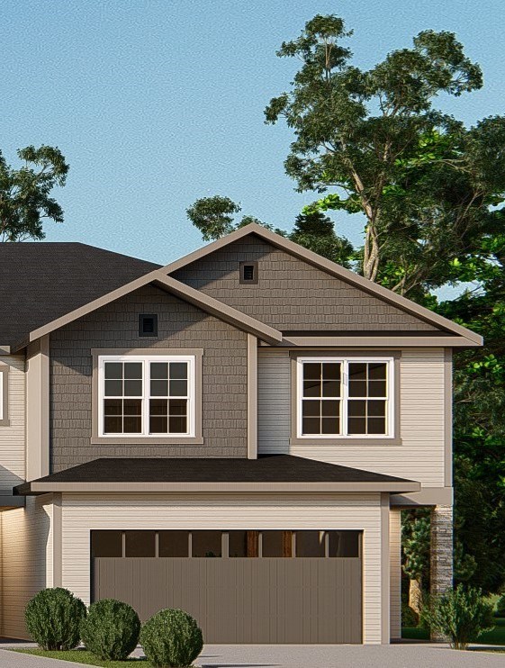 A two-story house with a garage and a gabled roof.