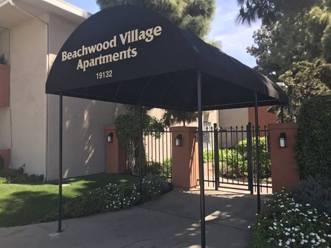 the entrance to the beachwood village apartments is guarded by a gate