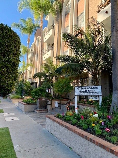 The side building of the castle heights apartments with a sign
