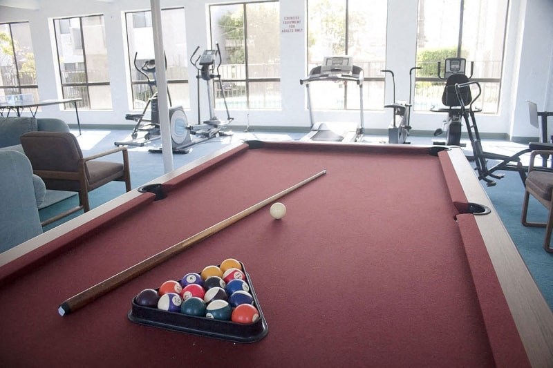 a pool table with a bunch of balls on it