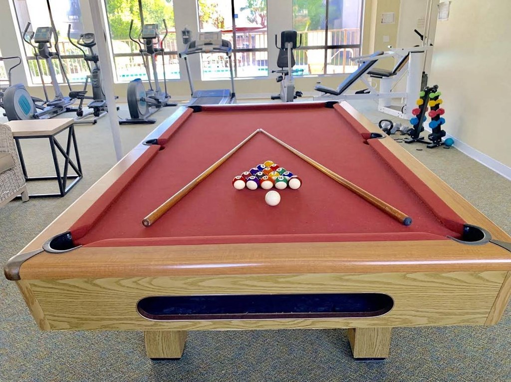 a pool table with balls on top of it