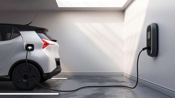 A car is charging at a wall socket.
