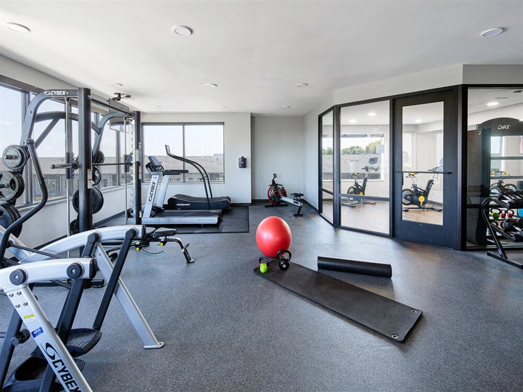 the gym is stocked with weights and other exercise equipment