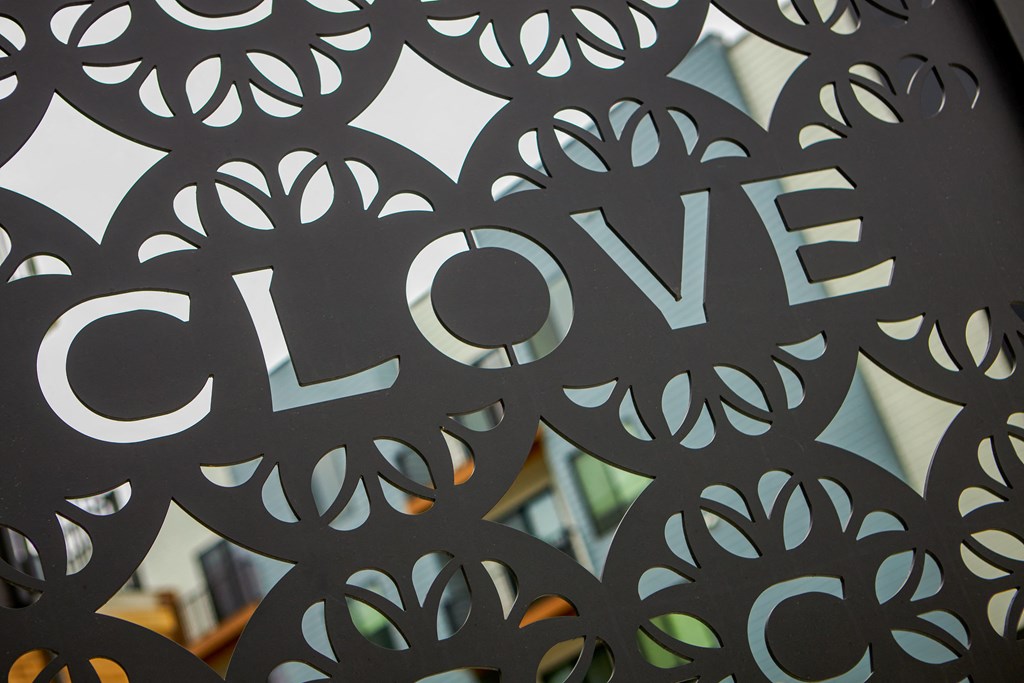 a close up of the word love etched into a metal wall