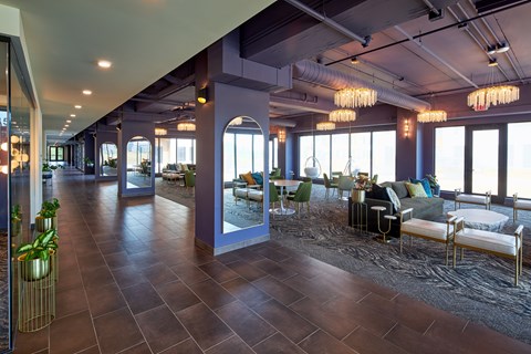 A large open space with a long hallway and a seating area.