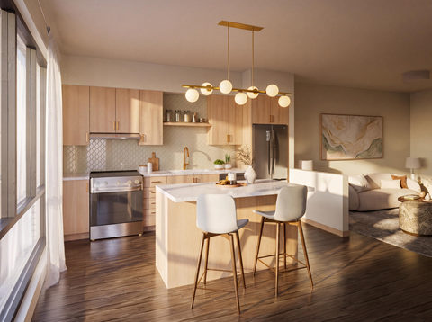 A modern kitchen with a dining table and chairs.