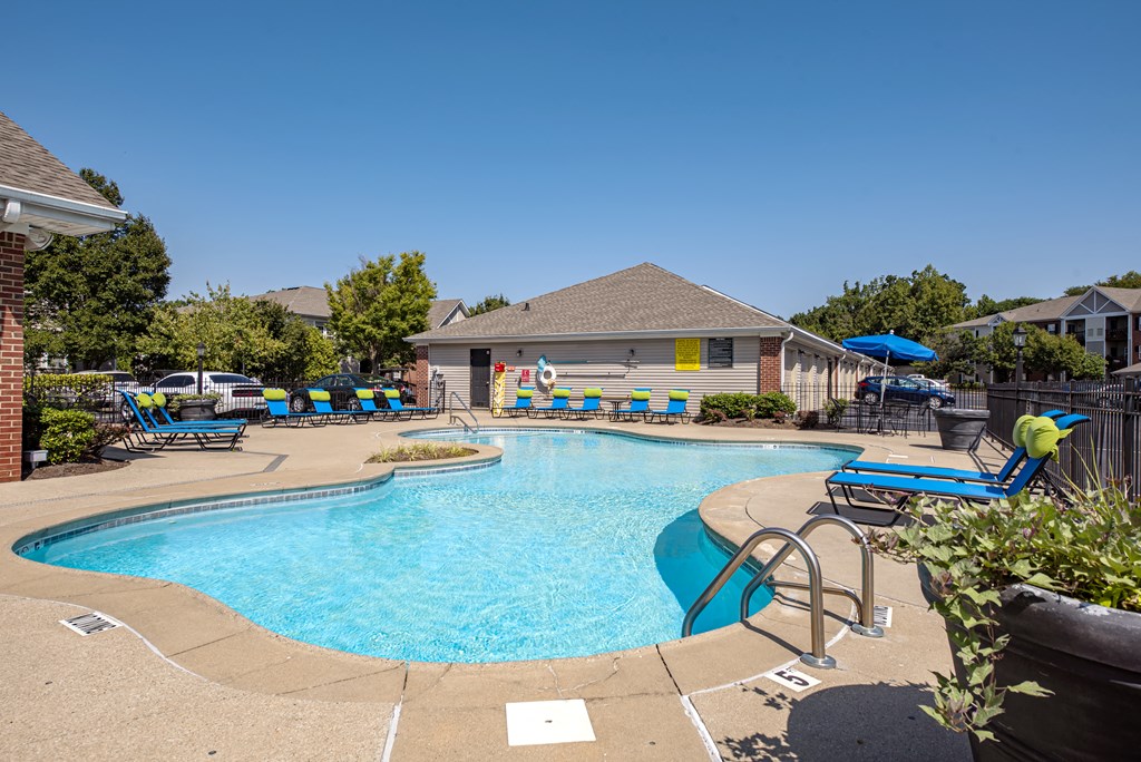 our apartments have a large swimming pool with chaise lounge chairs