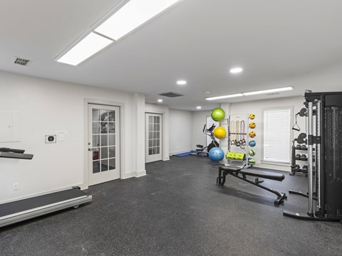 Fitness center with weights and equipment at Park at Meadow Ridge Montgomery AL
