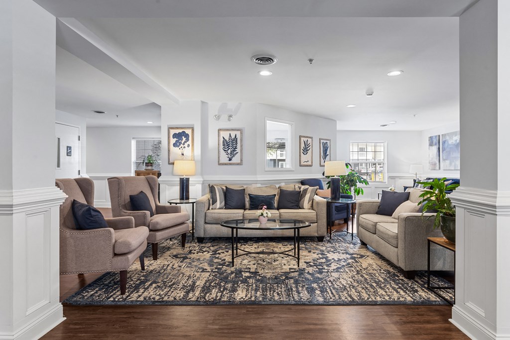 a living room with couches and chairs