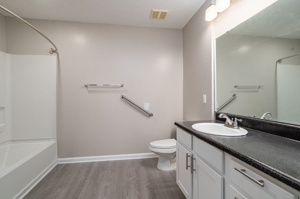 a bathroom with a toilet sink and bathtub