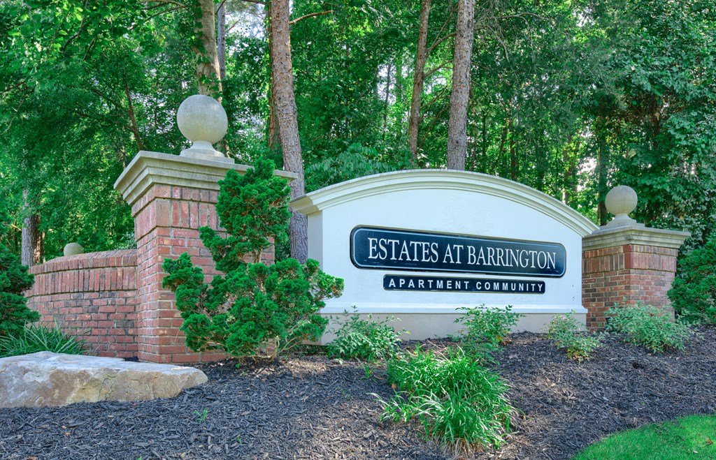 the sign at the entrance to estate at barrington apartments