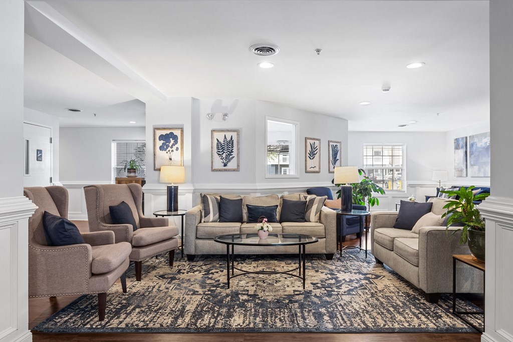 a living room with couches and chairs