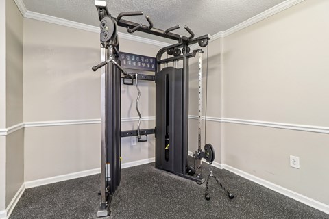 Fitness center with squat rack and bench at Avalon Place Columbia SC