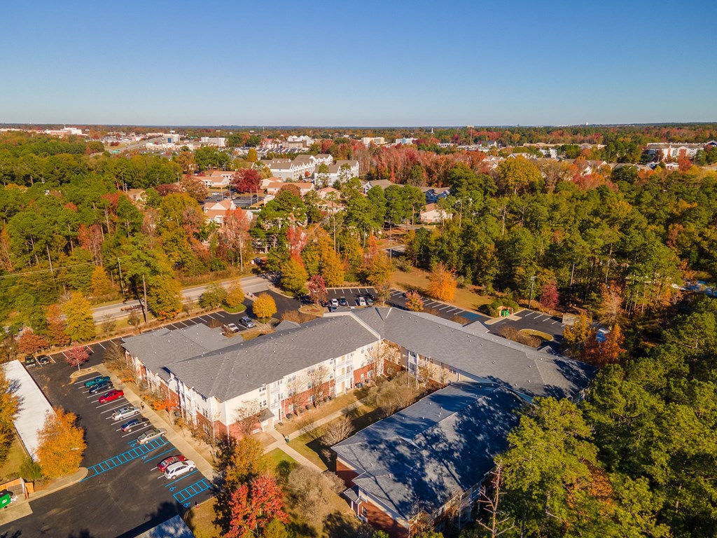 an aerial view of a building in the middle of a city